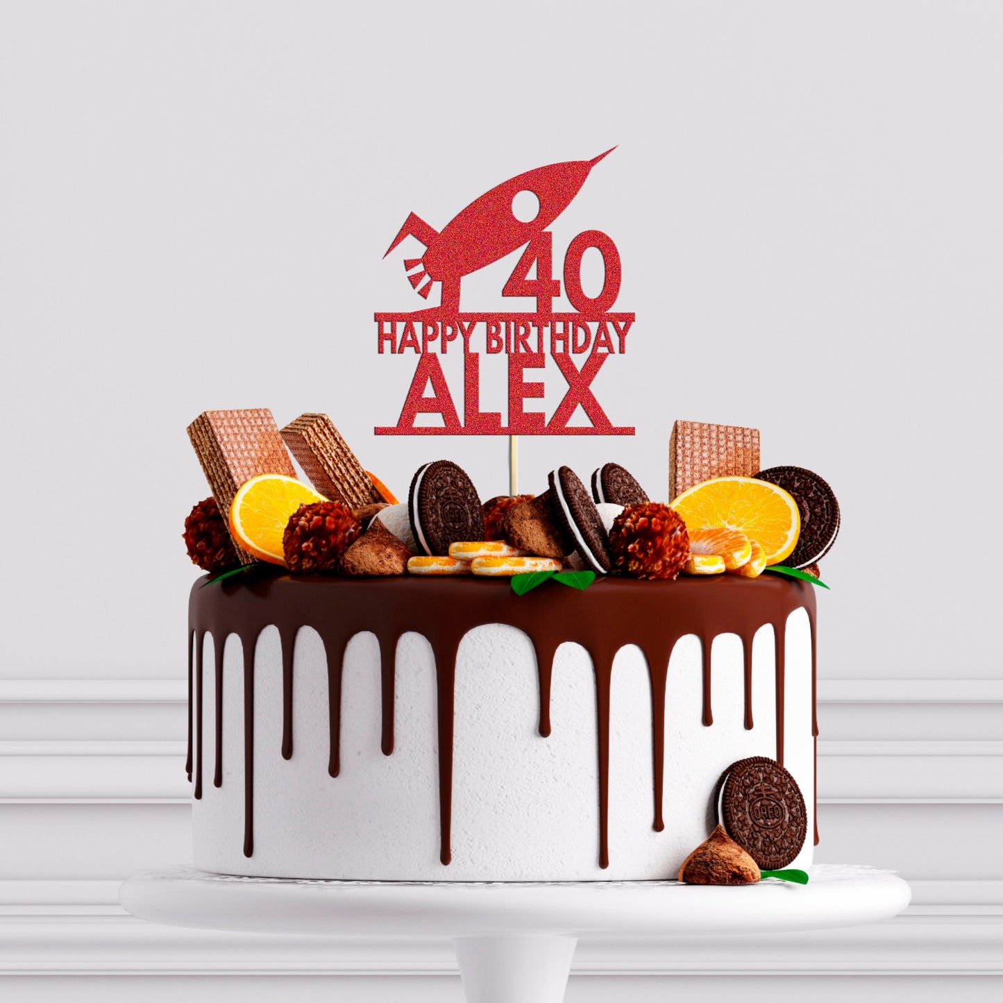 a birthday cake with a chocolate drizzle and orange slices