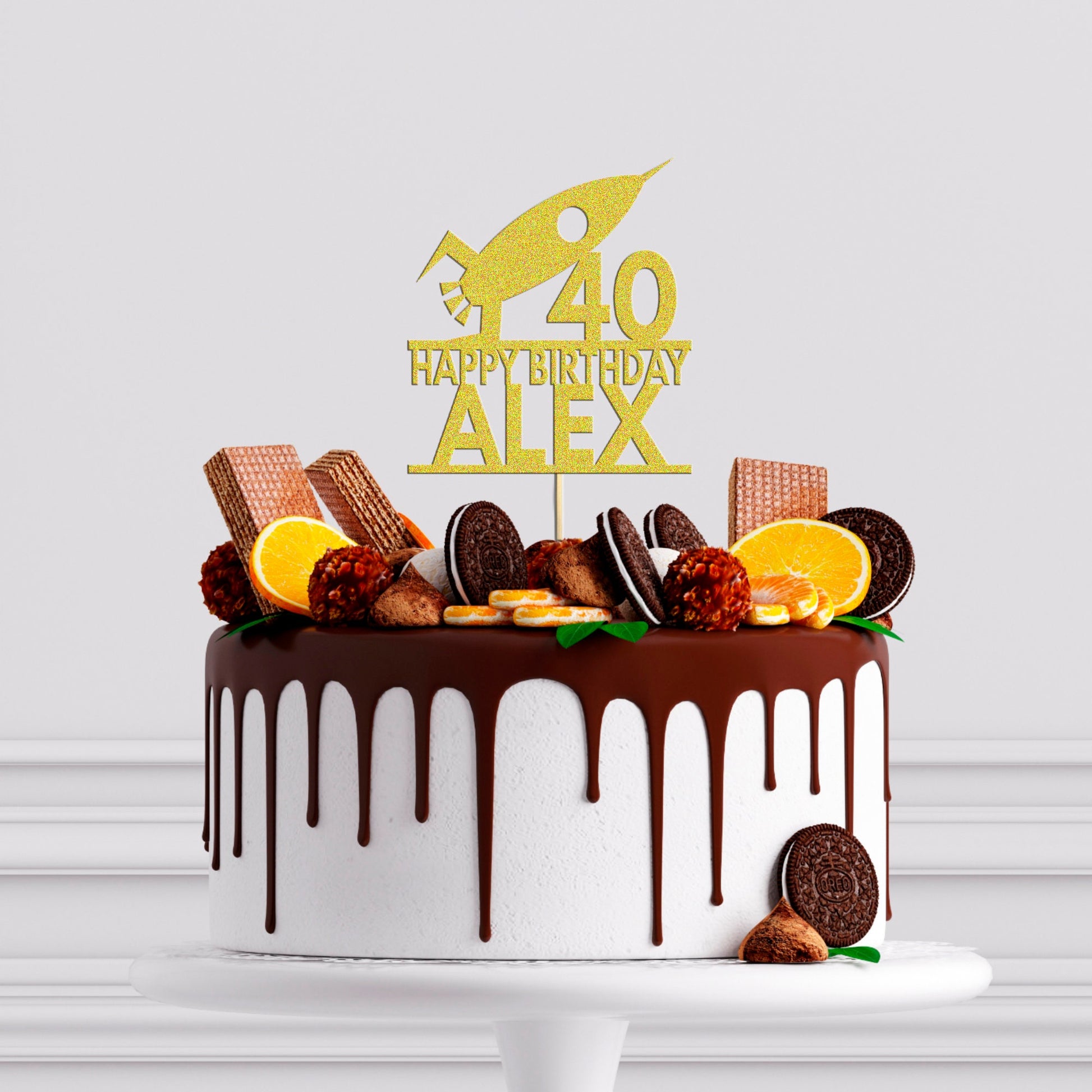 a birthday cake decorated with cookies and orange slices