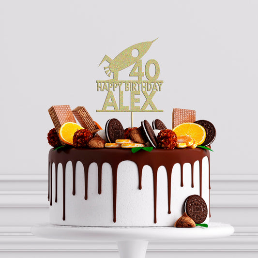 a birthday cake with chocolate icing and cookies on top