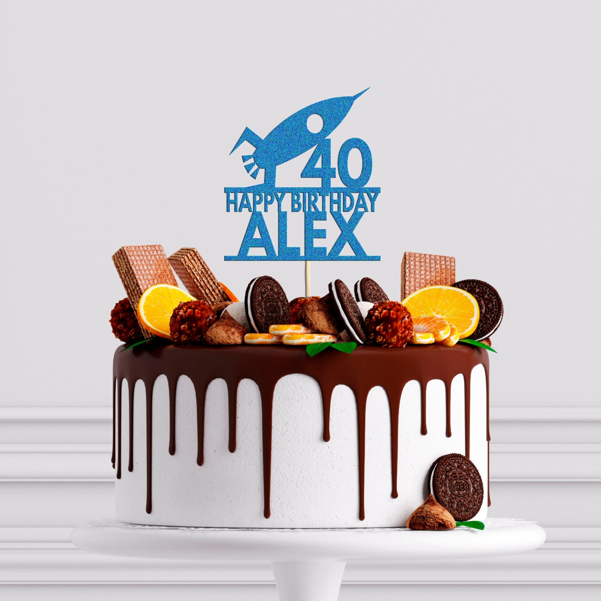 a birthday cake decorated with cookies and orange slices