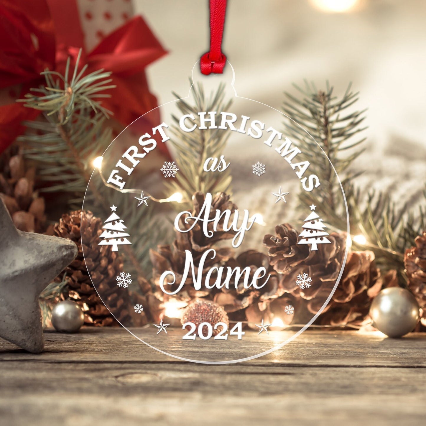 a glass ornament that says first christmas as any name