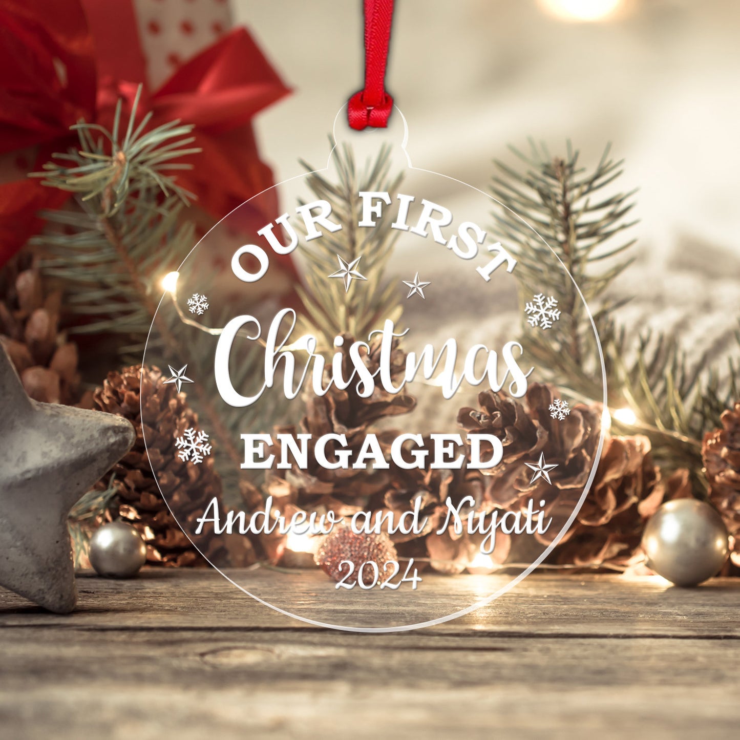 a glass ornament that says our first christmas engaged